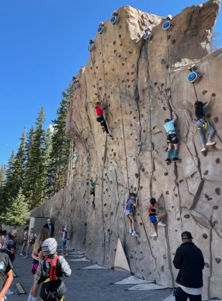 Fifth graders rock climbing outside